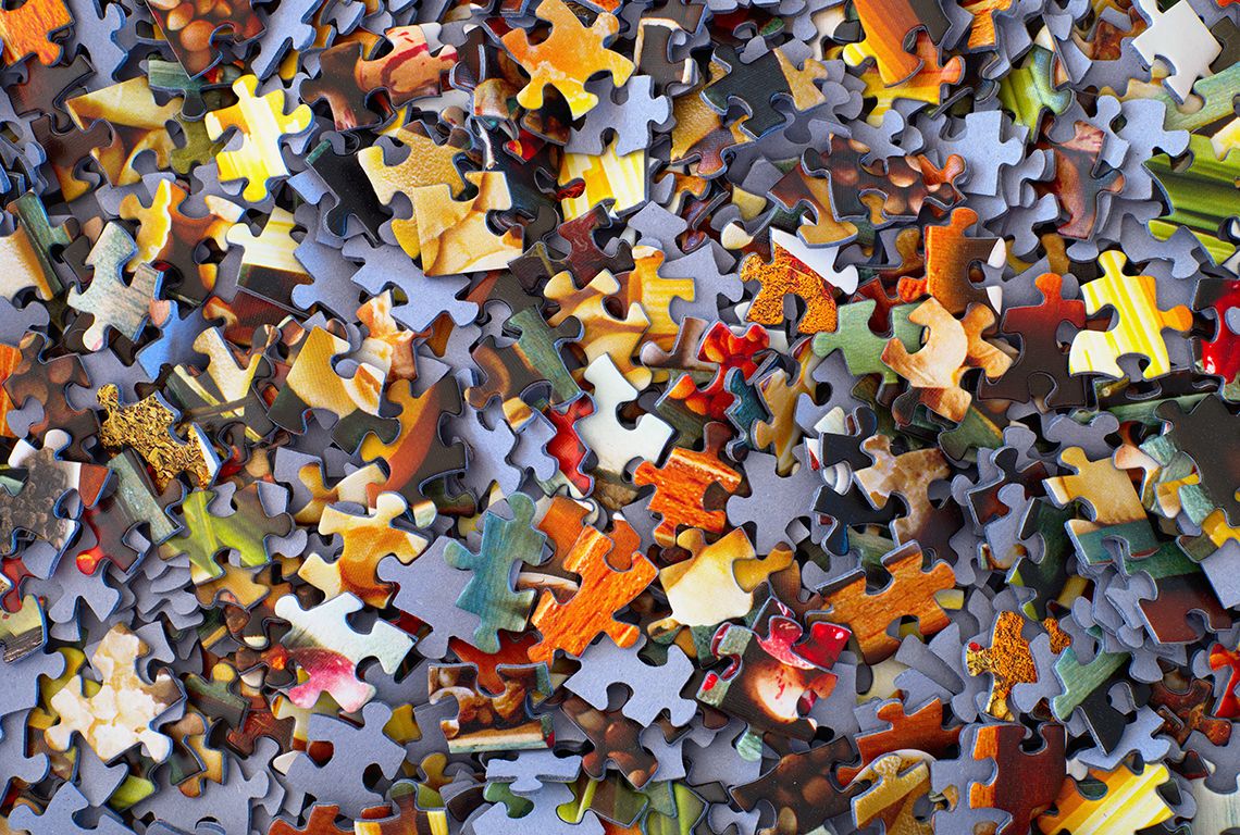 Puzzle pieces piled up together 