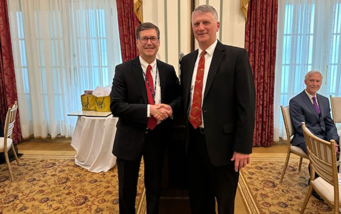 Dr. Belyea standing with Hal Frazier